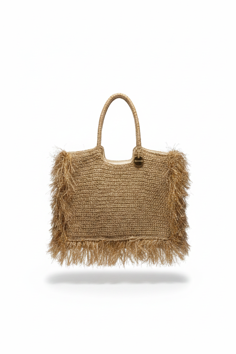 Vaaleanruskea punoslaukku, jossa hapsuja sivuilla ja pohjassa. 