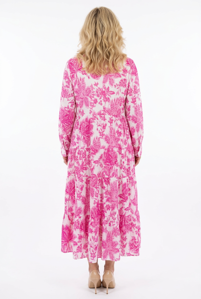 a-linjainen ja pitkähihainen maximekko valkoisella pohjalla fuksia kuosi takaa.