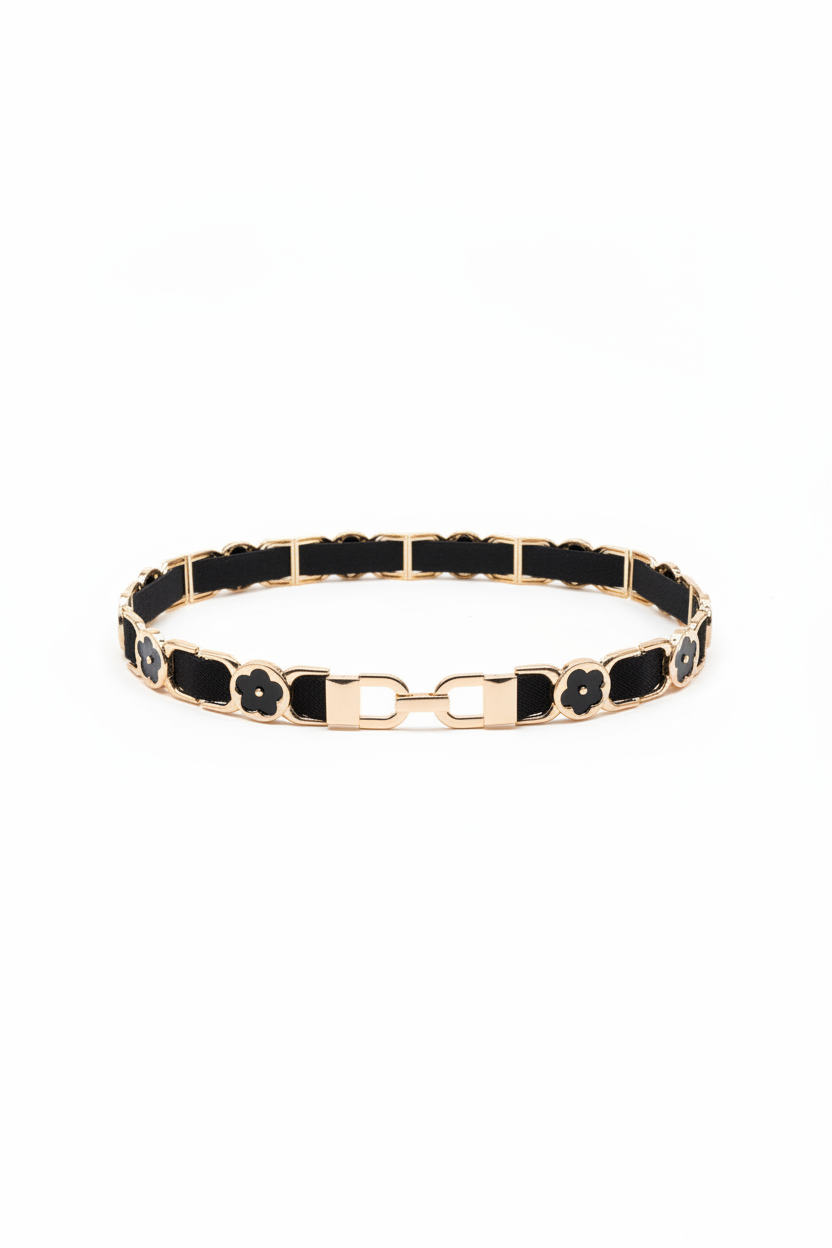 kapea musta-kulta vyö.